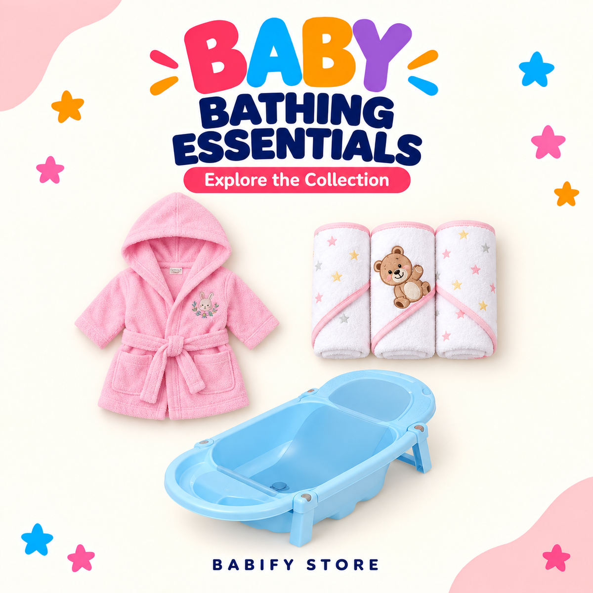 Baby bathing essentials featuring a blue foldable bathtub, pink hooded bathrobe and three pink-trimmed teddy-and-star towels