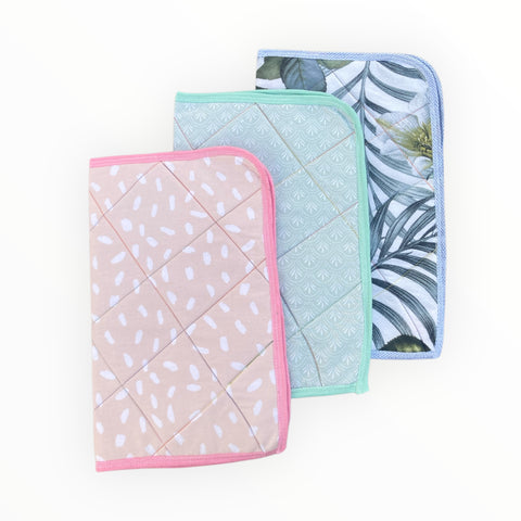 A soft, absorbent, and waterproof Baby Sozni Changing Sheet (18” x 15”) made of breathable cotton, designed for hygienic and comfortable diaper changes. Lightweight, foldable, and easy to wash, perfect for home or travel use.
