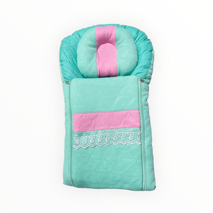 Soft and portable baby carry nest with head support, warmth, and comfort for newborns to 12 months. Lightweight and easy to carry for parents on the go.