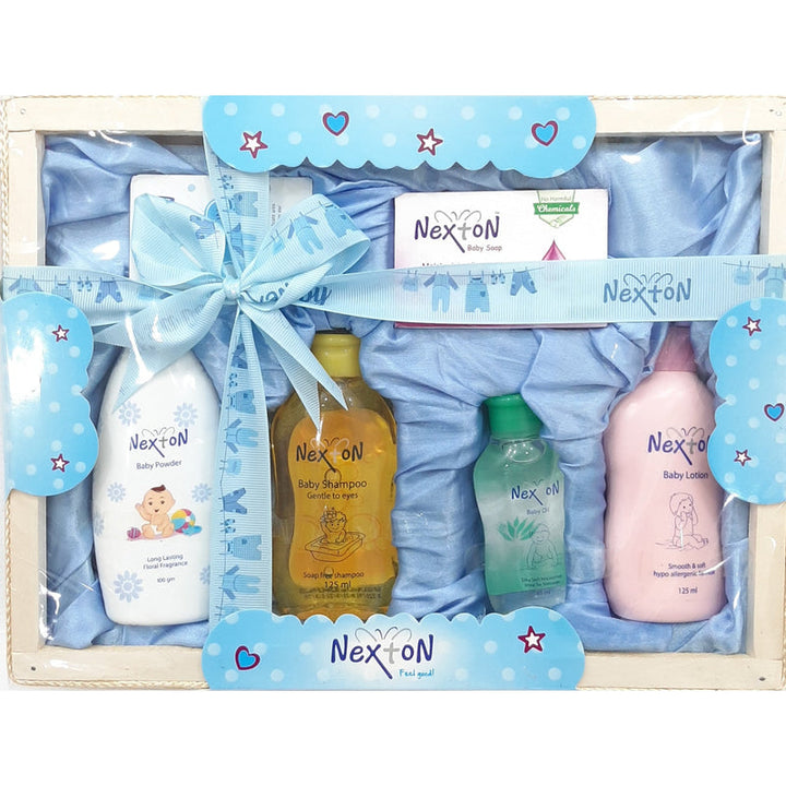 Nexton Baby Care Essentials Set with soap, powder, oil, shampoo, lotion, and cotton buds for gentle baby skincare.