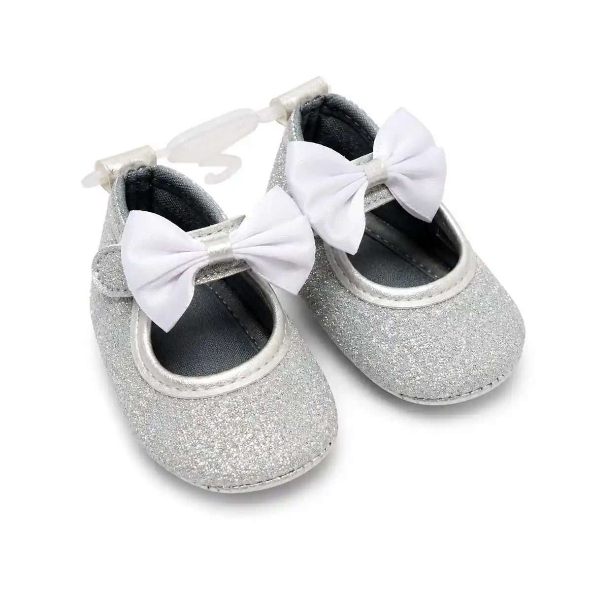 Silver white baby girl glitter bow soft sole first walker shoes with satin bow – angled view