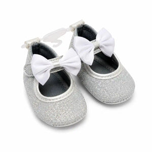 Silver white baby girl glitter bow soft sole first walker shoes with satin bow – angled view