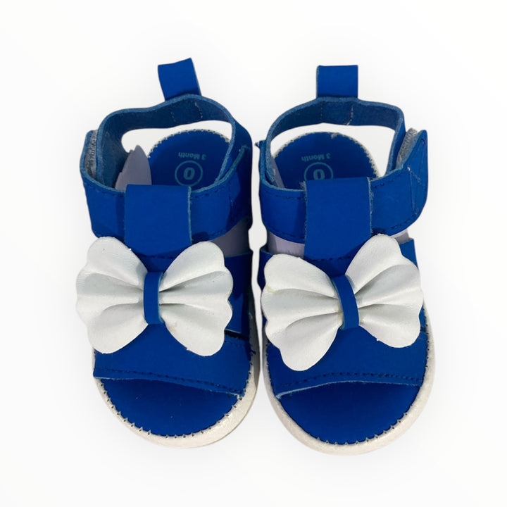 Soft and breathable baby sandals with cushioned insole, adjustable straps, and cute embellishments. Perfect for newborns and infants.