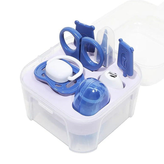Complete 7-piece baby nail care kit with essential grooming tools, including a finger brush, nipple, scissors, ear cleaner, hair remover, filer, and nail cutter.