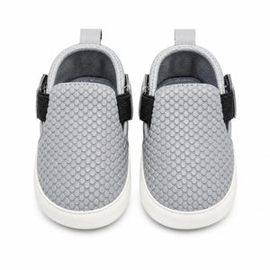 Light grey baby textured slip-on first walker shoes with soft flexible sole – front view