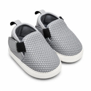 Light grey textured baby slip-on soft sole first walker shoes with elastic side panels – angled view