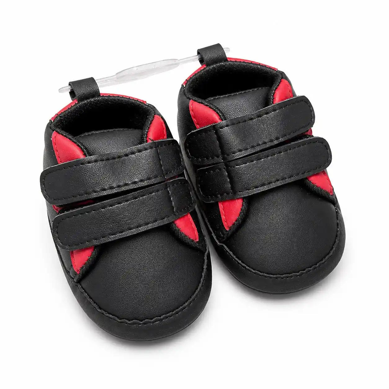 Black and red baby first walker shoes with double Velcro straps and soft sole – front angled view