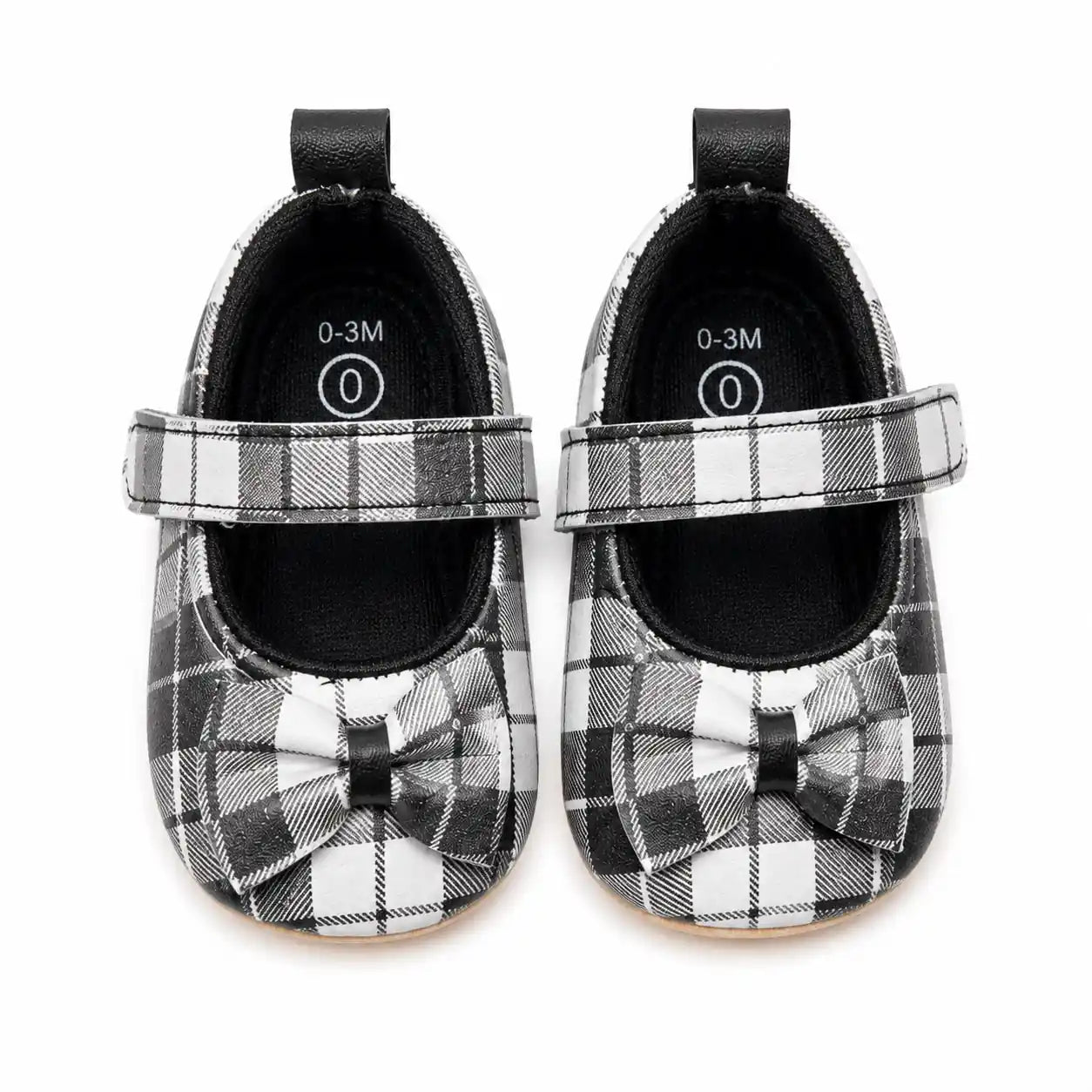 Black and white plaid baby girl Mary Jane soft sole shoes with decorative bow and hook-and-loop strap – front view