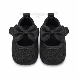Black glitter bow baby girl first walker shoes with soft sole – front view