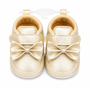 Golden bow baby girl soft sole first walker shoes with cushioned lining and hook and loop closure – front view