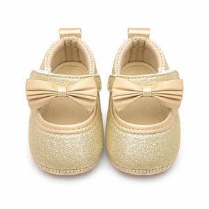 Golden champagne glitter baby girl first walker shoes with satin bow – front view