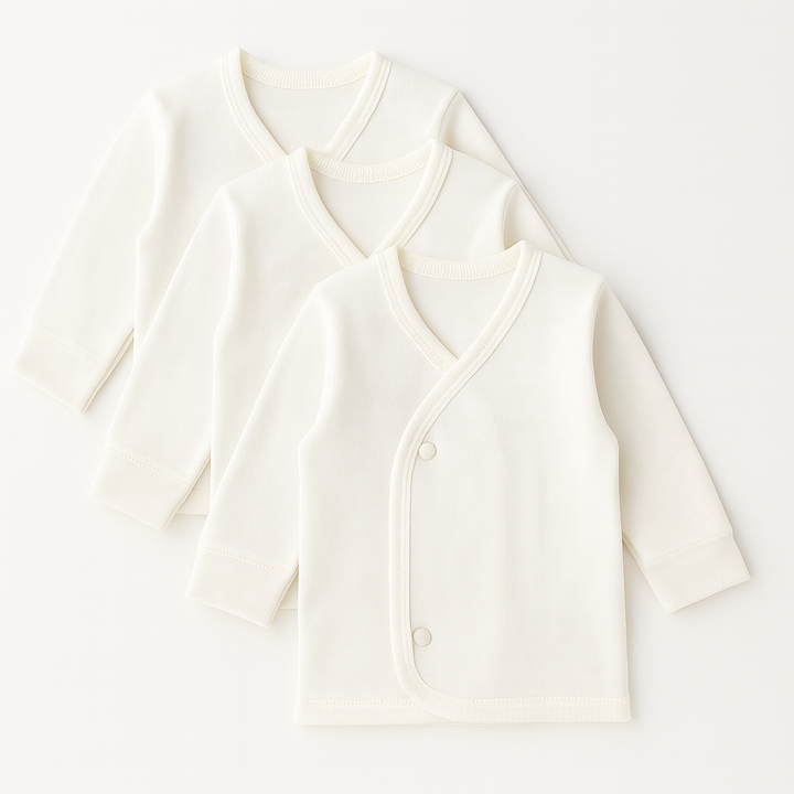 Pack of 3 baby banyans in white color with full sleeves and front button closure, made from soft interlock fabric