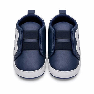 Navy blue and grey baby soft sole slip-on first walker shoes with elastic bands – front view