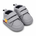 Grey double strap baby first walker shoes with textured upper, cushioned lining and colorful star side patch