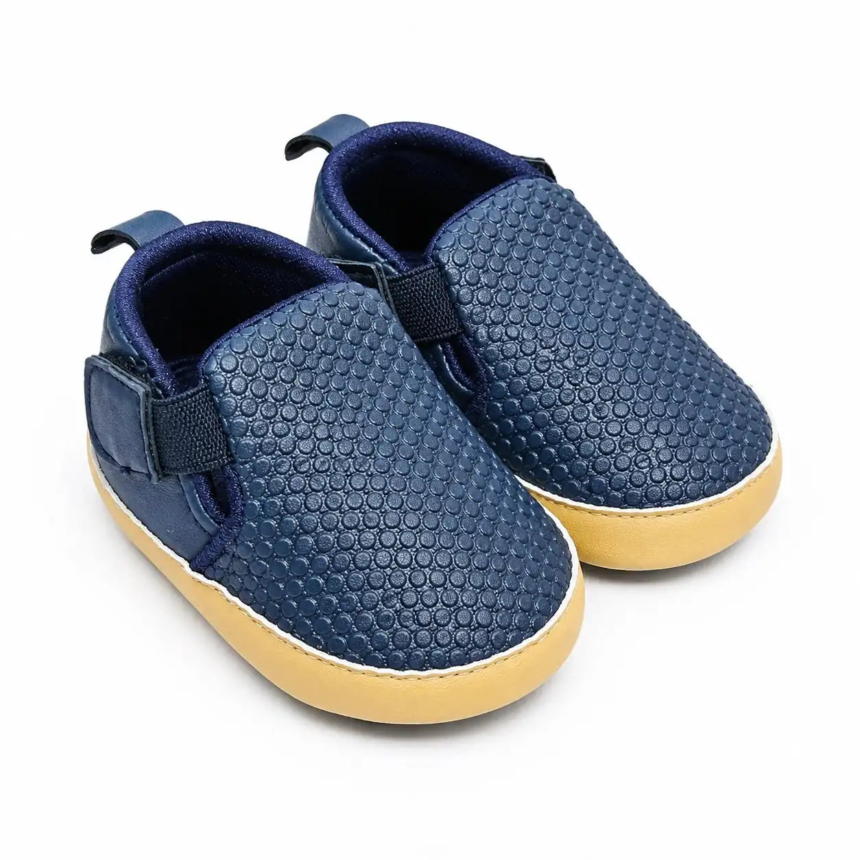 Navy blue textured baby slip-on first walker shoes with cushioned lining and flexible sole – angled view