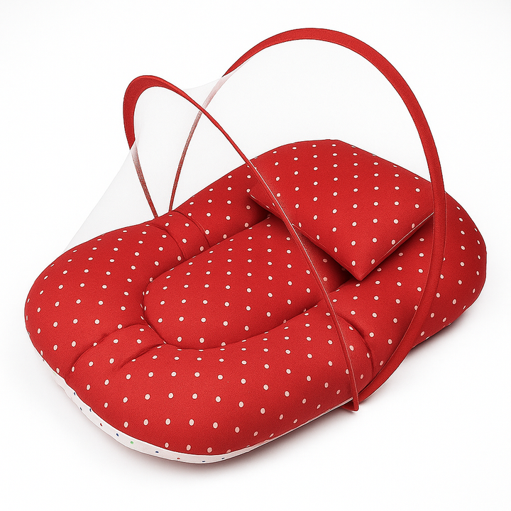 Red polka dot baby carry nest with attached mosquito net – soft, secure, and travel-friendly bed for infants.
