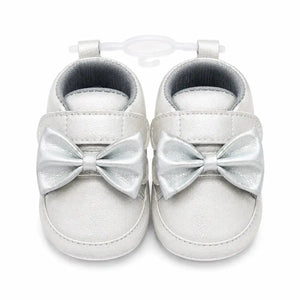 Silver bow baby girl soft sole first walker shoes with cushioned lining and hook and loop closure – front view