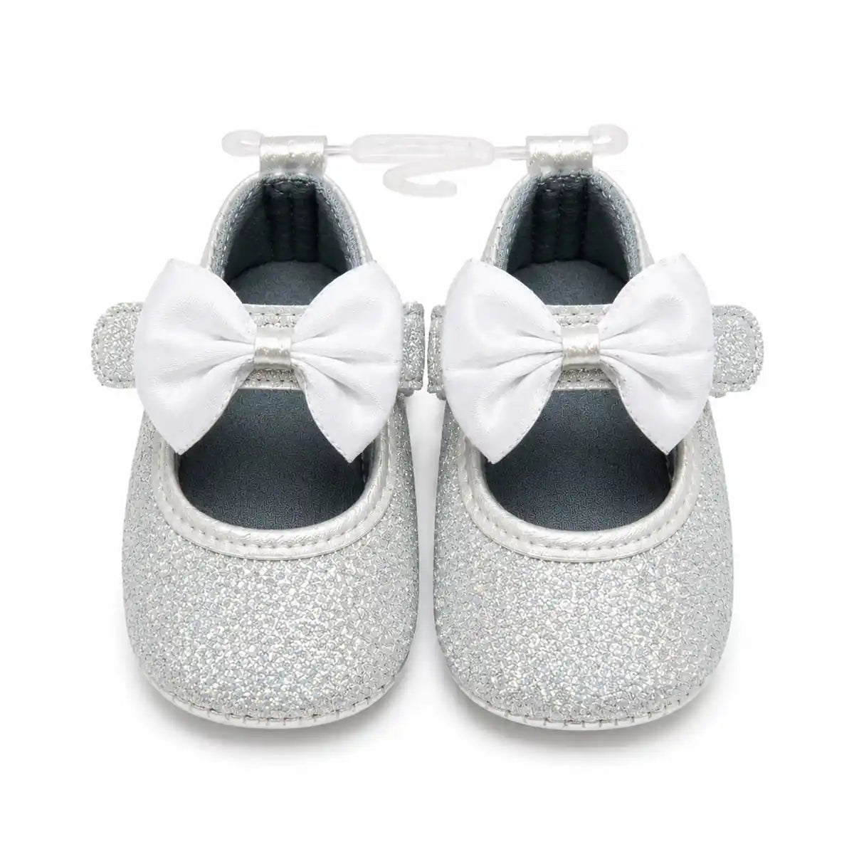 Silver white glitter baby first walker shoes with white satin bow and hook loop strap – front view