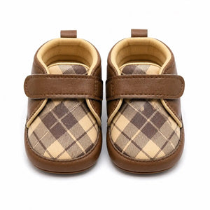 Front view of brown and beige plaid baby shoes with adjustable single strap for 0–12 months