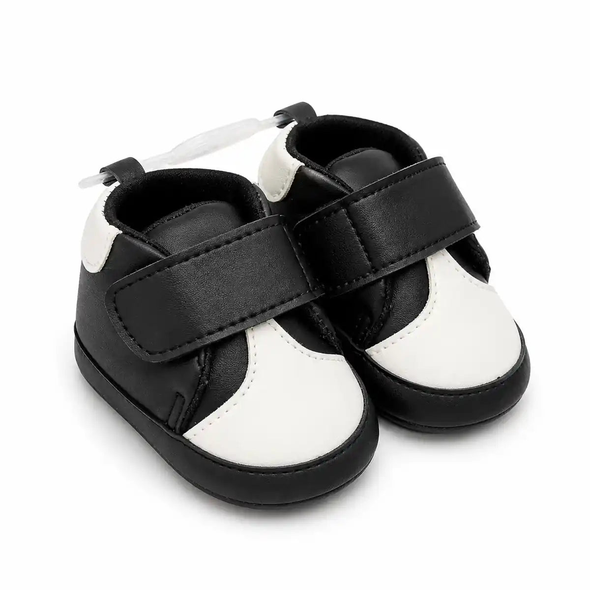 Baby black and white soft sole first walker shoes with hook-and-loop strap – angled view