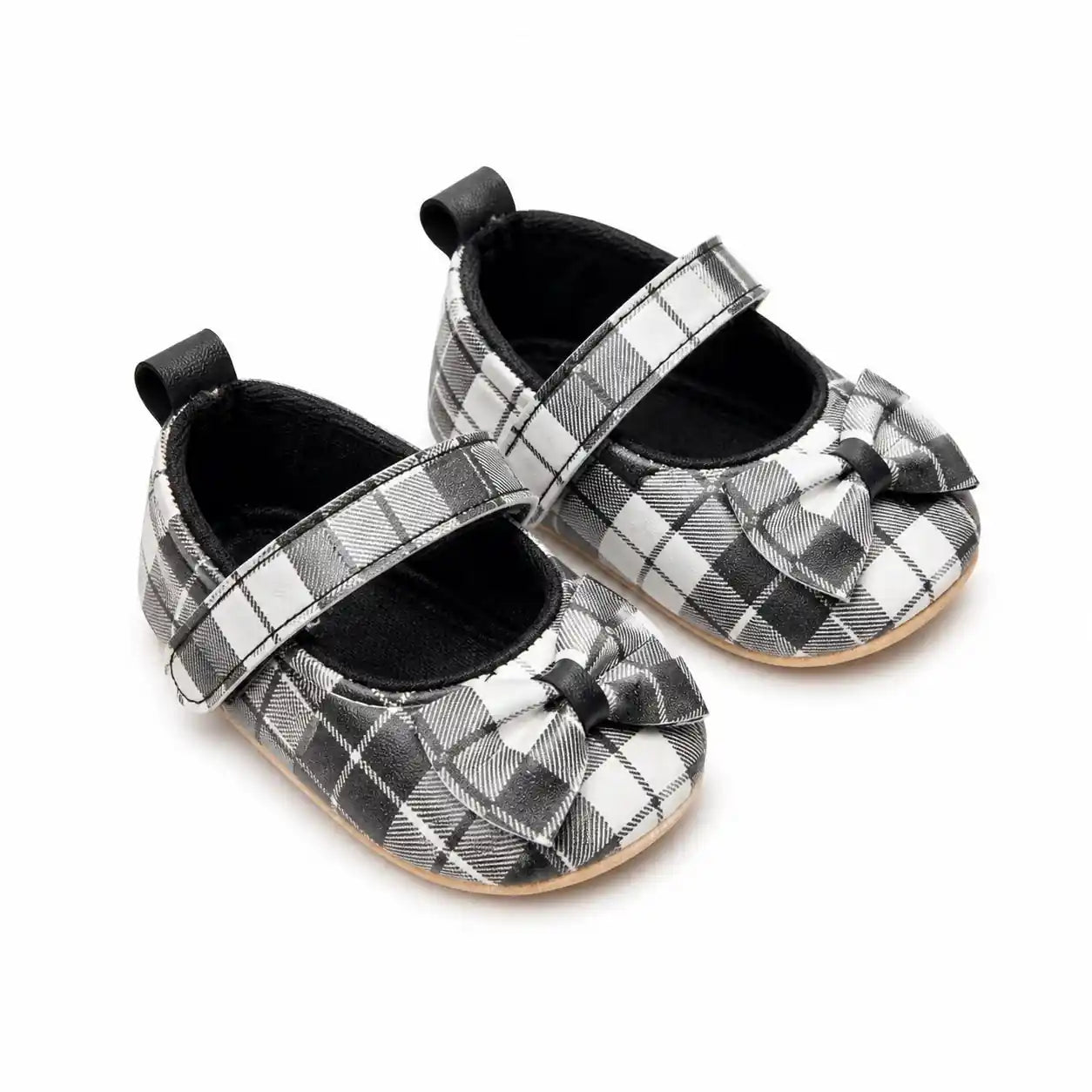 Black and white plaid bow baby girl first walker shoes with soft sole and adjustable strap – angled view