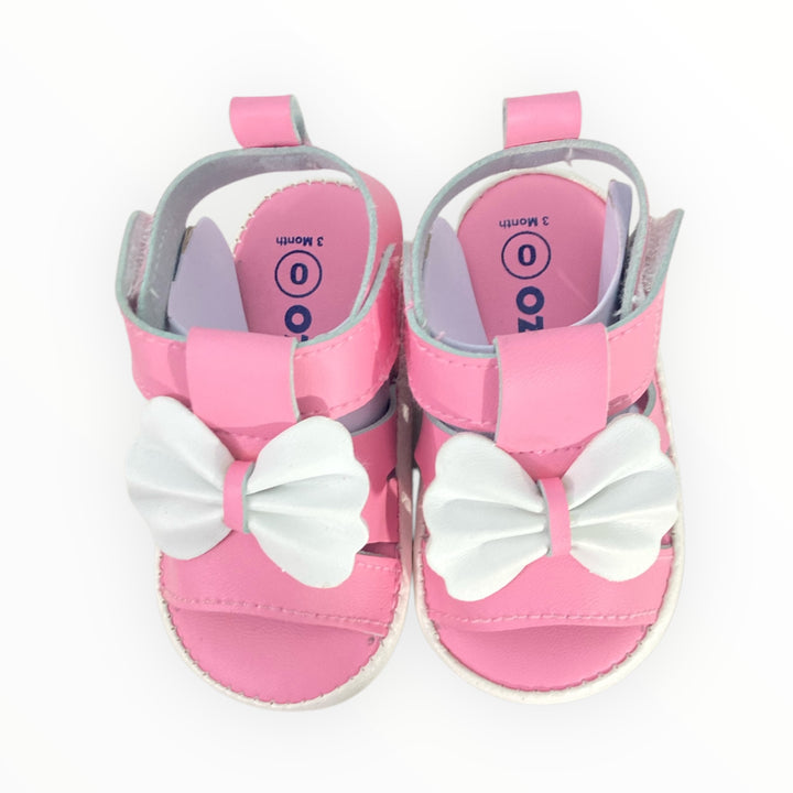 Soft and breathable baby sandals with cushioned insole, adjustable straps, and cute embellishments. Perfect for newborns and infants.