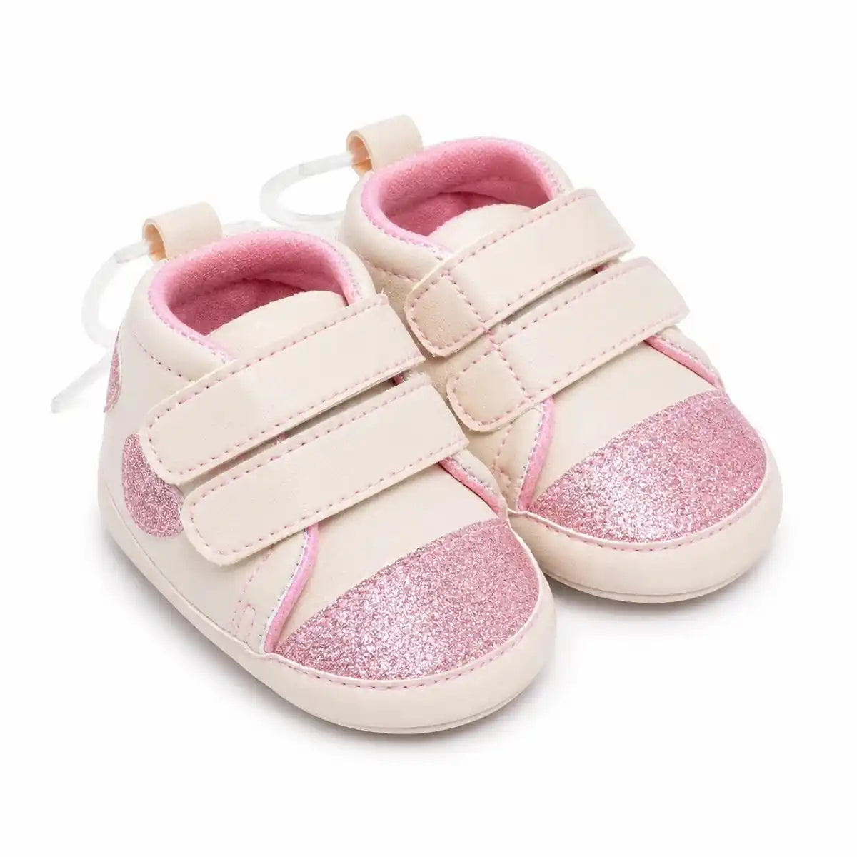 Cream pink baby girl first walker shoes with glitter toe cap and double hook and loop straps – angled view