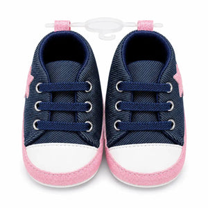 Navy blue and pink denim baby girl first walker shoes with elastic laces and white toe – front view