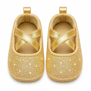 Golden glitter baby girl shoes with cross straps front view in Pakistan