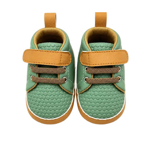 Green baby shoes with velcro strap front view in Pakistan