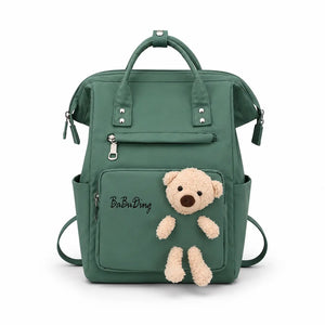 Green baby diaper bag backpack with teddy bear front view