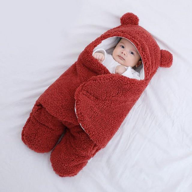 Soft lamb baby swaddle blanket with cotton lining, adjustable wrap, bear hood, and foot design for warmth and comfort. Ideal for babies 0-6 months.