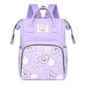 Lavender baby diaper bag backpack with bear print worn by mother