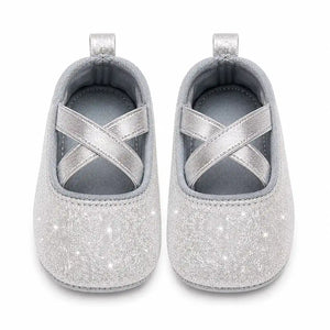 Silver glitter baby girl shoes with cross straps front view in Pakistan