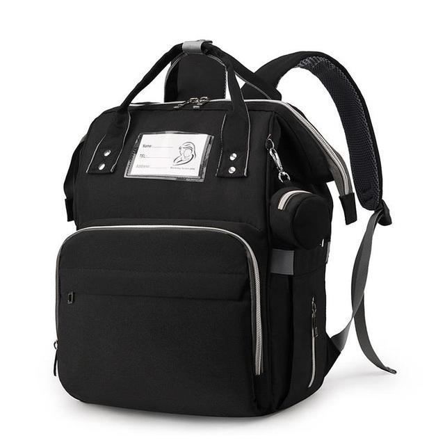 Spacious waterproof diaper bag with a built-in changing station, USB charging port, and insulated bottle pockets.