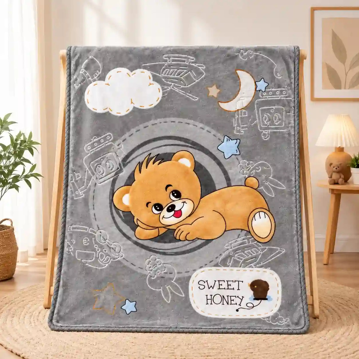 Grey baby blanket with cute teddy bear print and soft plush fabric