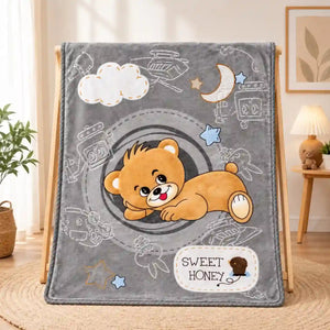 Grey baby blanket with cute teddy bear print and soft plush fabric