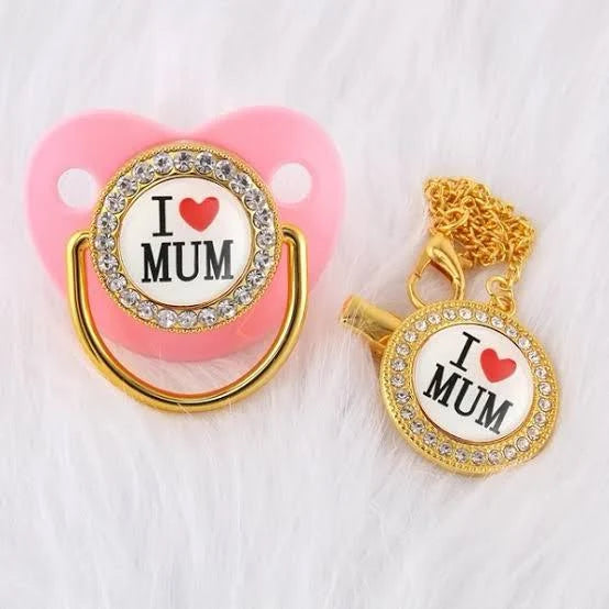 I Love Mum baby bling pacifier with matching clip on soft background 