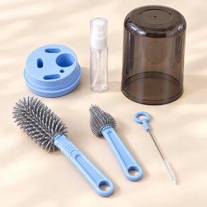 Blue 6-in-1 baby bottle brush cleaning set with bottle brush, nipple brush, straw brush, dispenser and dust cover