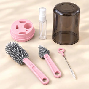 Pink 6-in-1 baby bottle cleaning brush set with bottle brush, nipple brush, straw brush and dispenser