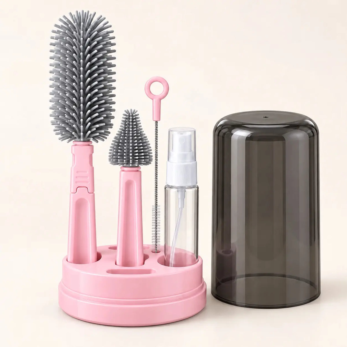 Pink silicone baby bottle brush set with drying base, cleaning brushes, soap dispenser and dust cover