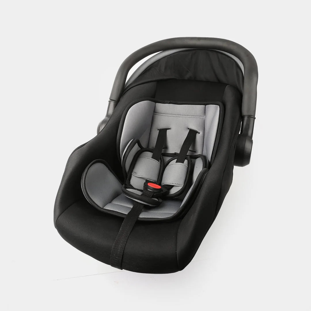 Black and red baby carrycot showing padded seat and safety harness