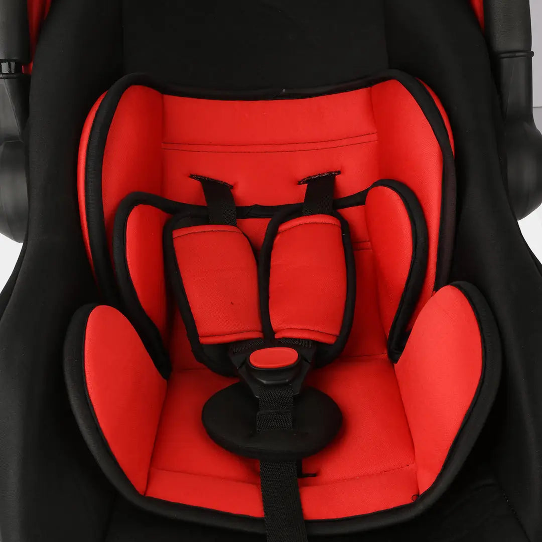 Close-up of red padded carrycot seat and safety buckle