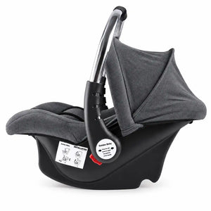 Grey baby carry cot and car seat with stainless steel handle, padded interior and safety straps