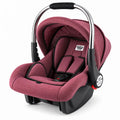 Red baby carry cot and car seat with stainless steel handle, padded interior and adjustable canopy