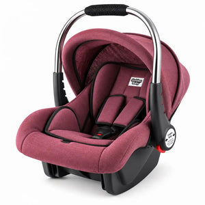 Red baby carry cot and car seat with stainless steel handle, padded interior and adjustable canopy
