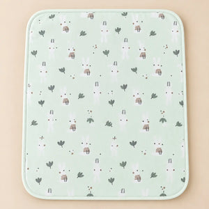 Mint green waterproof baby changing sheet with white bunny and leaf design