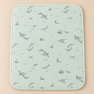 Light mint baby changing sheet with whale, dolphin and sailboat print