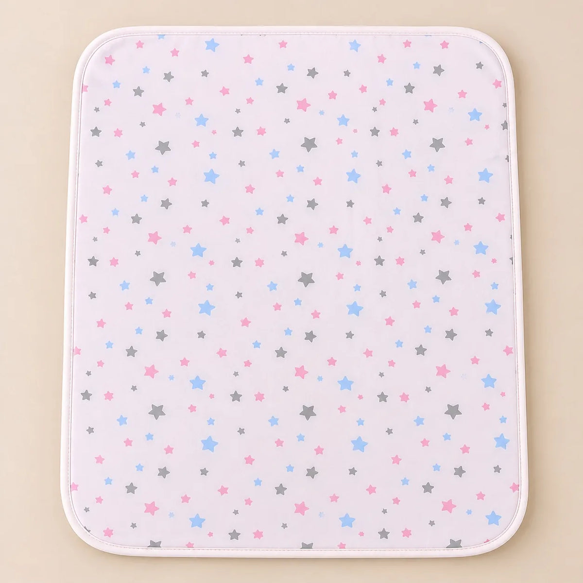 Pink waterproof baby changing mat with multicolor star print