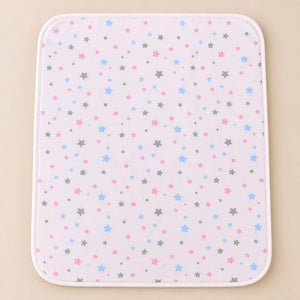 Pink waterproof baby changing mat with multicolor star print
